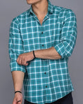 Man in Turquoise Checkered Shirt Adjusting Sleeves (Size M)